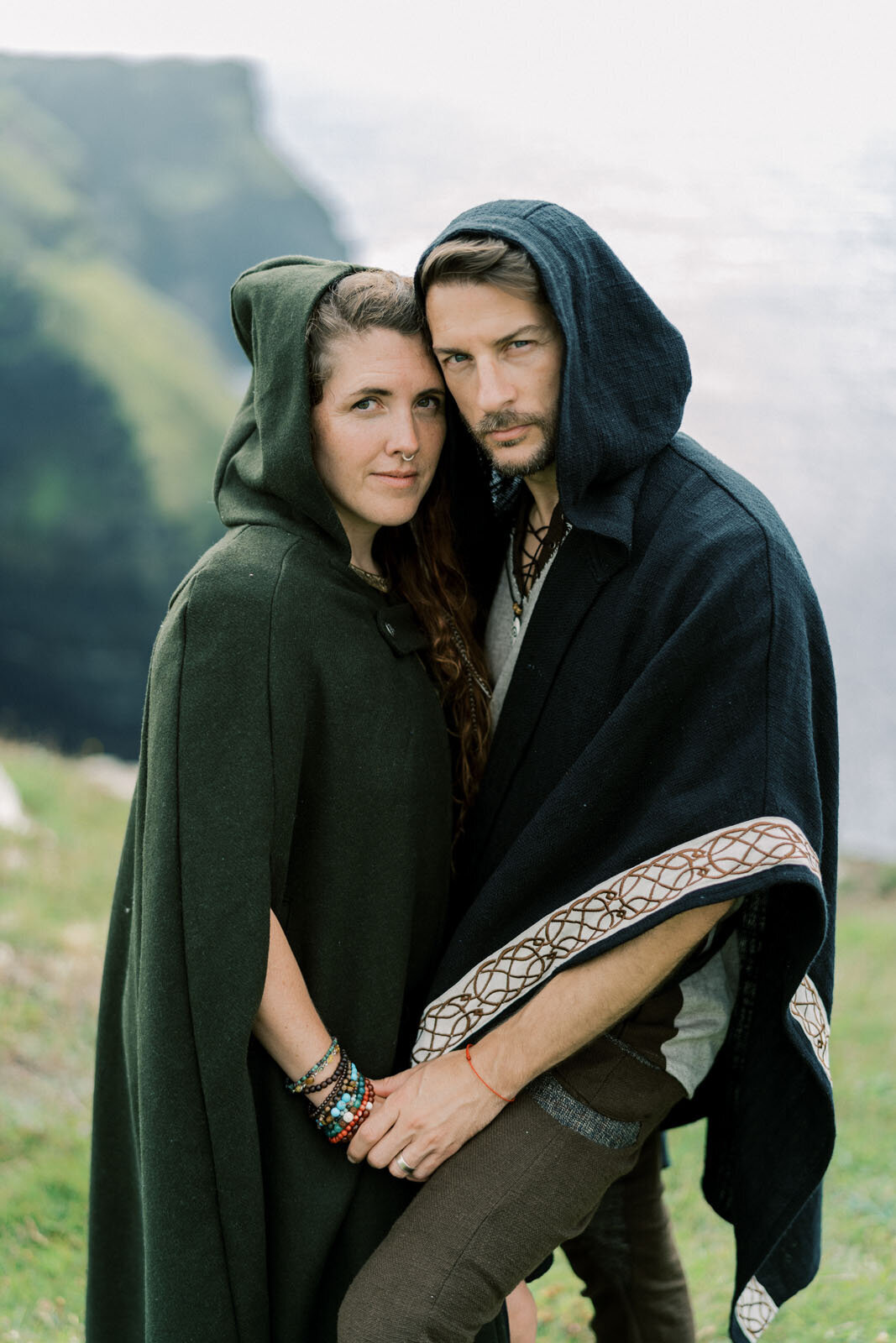 Britton and Carolee in cloaks at the Cliffs of Moher